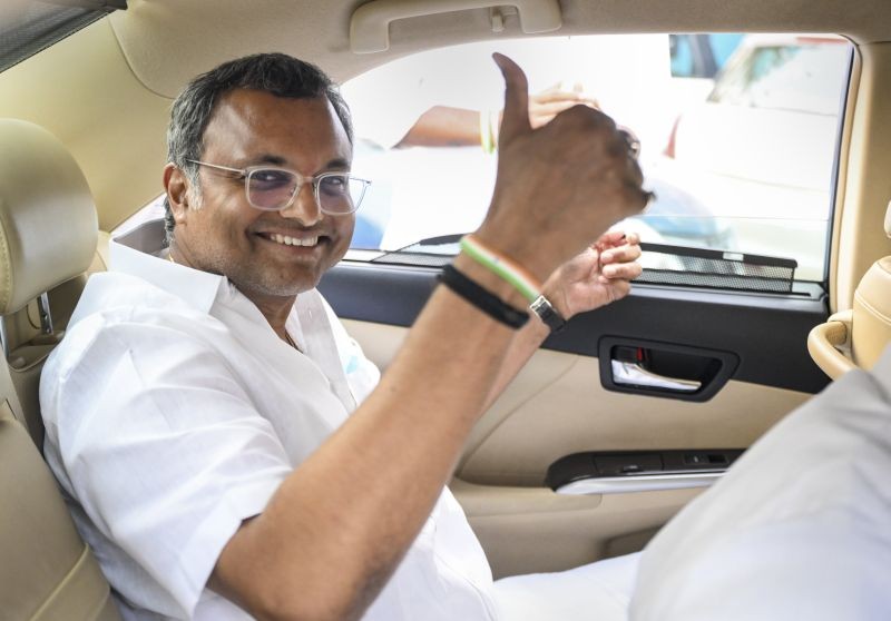 Congress MP Karti Chidambaram, accused of facilitating visas for Chinese nationals by flouting rules, gestures as he leaves the CBI headquarters, in New Delhi on May 26. (PTI Photo)