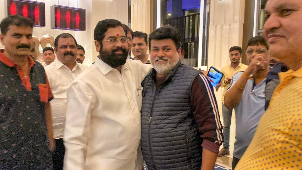 Maharashtra minister and Shiv Sena leader Uday Samant with rebel party leader Eknath Shinde and other supporting MLAs, at Radisson Blu Hotel in Guwahati, on Sunday, June 26, 2022. Photograph: PTI Photo