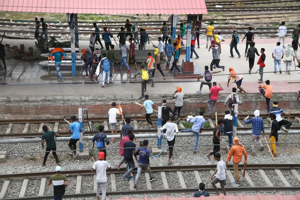 Danapur: Protester vandalise properties at the Danapur Railway Station in protest against the 'Agnipath' scheme outside Danapur Railway Station, near Patna, Friday, June 17, 2022. (PTI Photo)