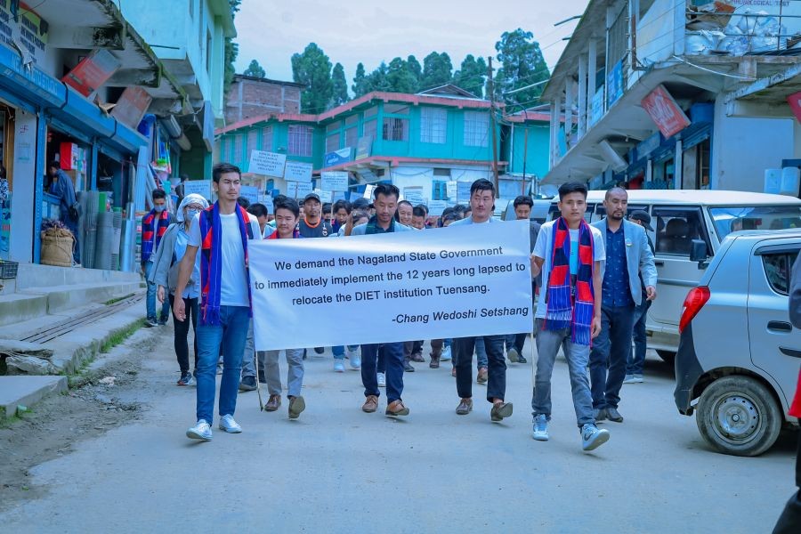 Participants displaying placards during the programme organised by the CWS at Clock Tower, Tuensang town on June 20. (Morung Photo)