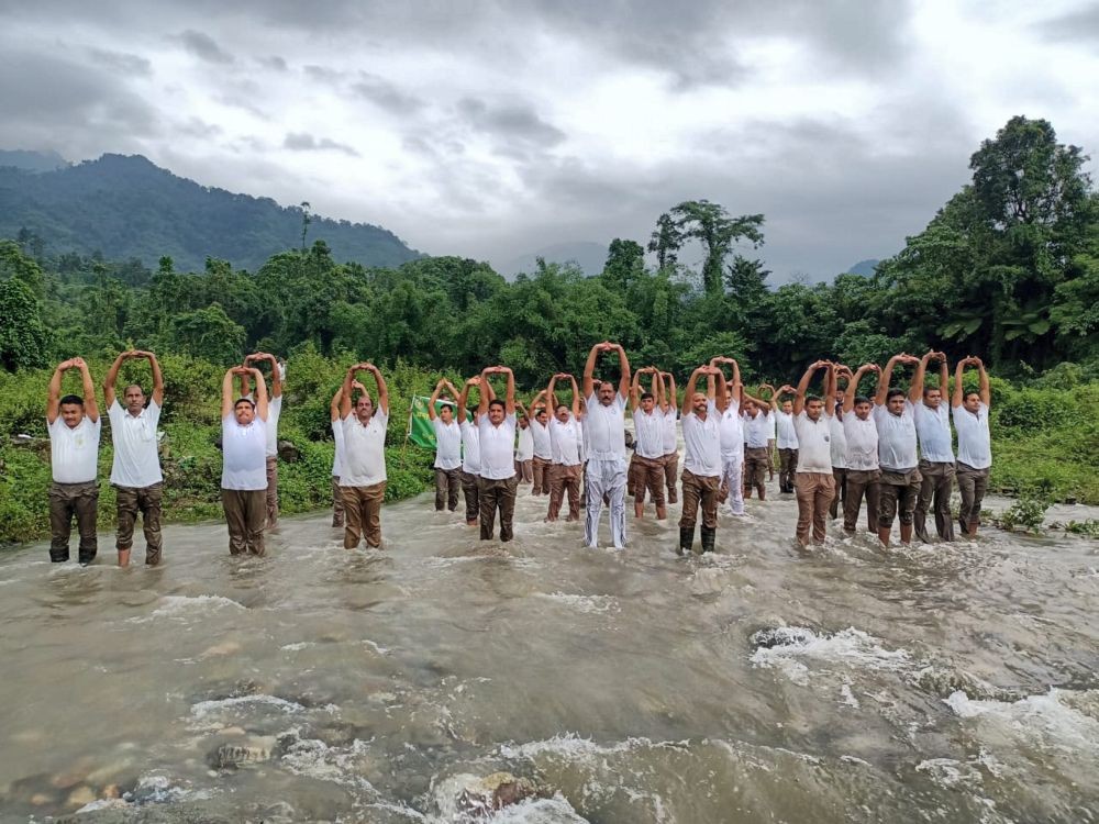 **EDS: IMAGE POSTED BY @ITBP_official** Lohitpur: ITBP personnel practice yoga in a river to celebrate the International Day of Yoga, in Lohitpur, Arunachal Pradesh, Tuesday, June 21, 2022. (PTI Photo)