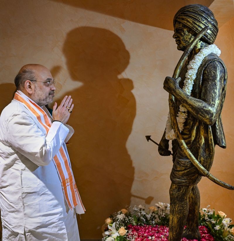 Union Home Minister Amit Shah pays homage to Birsa Munda during inauguration of the National Tribal Research Institute as part of the ‘Azadi Ka Amrit Mahotsav’ celebration by the Ministry of Tribal Affairs, in New Delhi on June 7, 2022.  (PTI Photo)