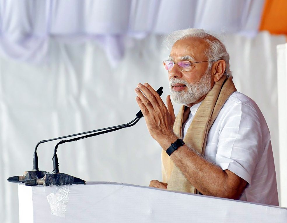 **EDS: HANDOUT PHOTO MADE AVAILABLE FROM PIB ON FRIDAY, JUNE 3, 2022** Kanpur: Prime Minister Narendra Modi addresses a public function, at Paraunkh village in Kanpur. (PTI Photo)
