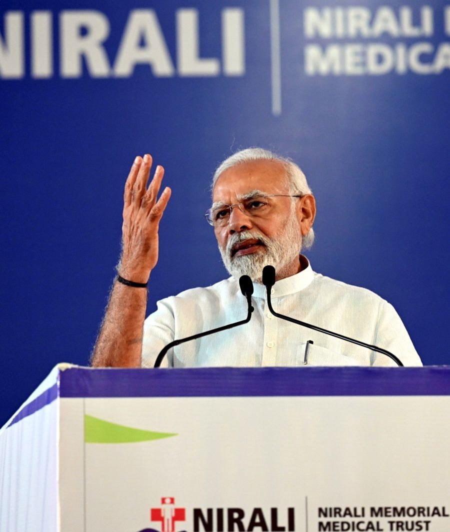 **EDS: HANDOUT PHOTO MADE AVAILABLE FROM PIB ON FRIDAY, JUNE 10, 2022** Navsari: Prime Minister Narendra Modi addresses the inauguration of A.M. Naik Healthcare Complex and Nirali Multi Speciality Hospital, in Navsari. (PTI Photo)