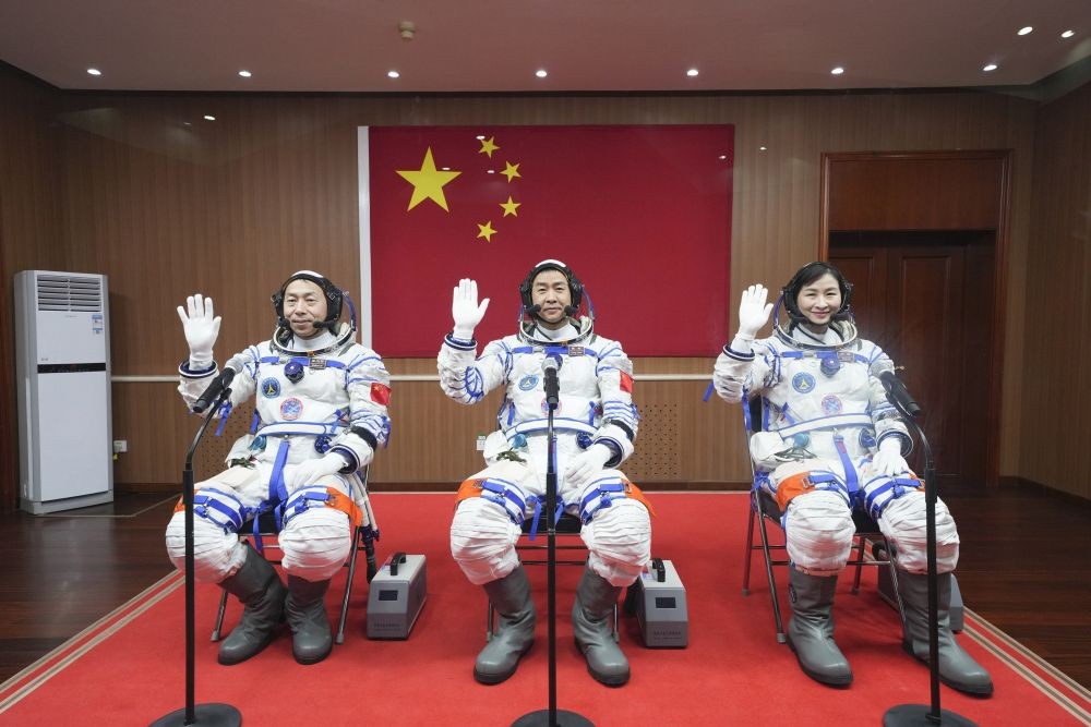 In this photo released by Xinhua News Agency, from left Chinese astronauts Cai Xuzhe, Chen Dong and Liu Yang wave before a sendoff ceremony for the Shenzhou-14 crewed space mission at the Jiuquan Satellite Launch Center in northwestern China on Sunday, June 5, 2022. China on Sunday launched a new three-person mission to complete work on its permanent orbiting space station. AP/PTI
