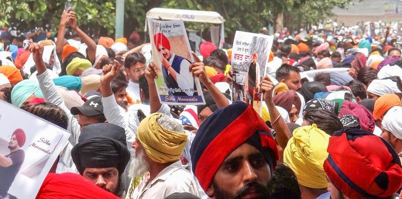 Supporters and fans of Punjabi singer and Congress leader Sidhu Moose Wala gather for his 'antim ardas' and 'bhog' ceremony, in Mansa district on June 8, 2022. (PTI Photo)