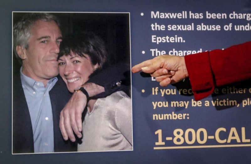 Audrey Strauss, acting U.S. attorney for the Southern District of New York, points to a photo of Jeffrey Epstein and Ghislaine Maxwell, during a news conference in New York, on July 2, 2020. Maxwell faces the likelihood of years in prison when she is sentenced for helping the wealthy financier Jeffrey Epstein sexually abuse underage girls. The sentencing hearing, Tuesday, June 28, 2022, in New York will be the culmination of a prosecution that detailed how Epstein and Maxwell flaunted their riches and associations with prominent people to groom vulnerable girls and then exploit them. (AP File Photo)