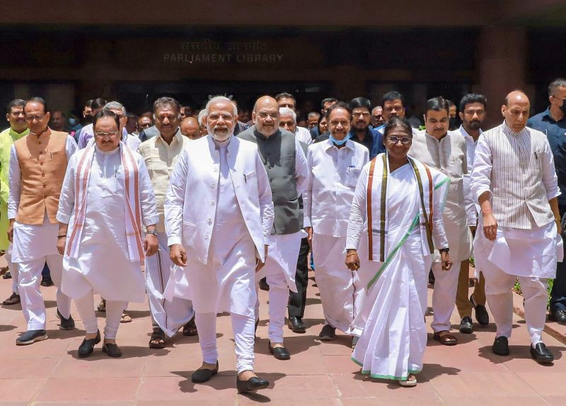NDA's candidate Droupadi Murmu, accompanied by Prime Minister Narendra Modi, Union Ministers Rajnath Singh, Amit Shah, BJP President J P Nadda and other dignitaries, walks towards Parliament House to file her nomination papers for presidential election, in New Delhi oni June 24, 2022. (PTI Photo)