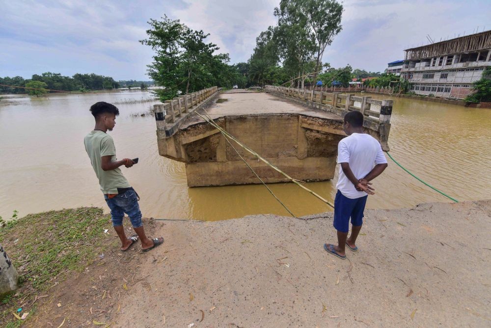 Nagaon: A damaged section of a bridge following floods in Nagaon district, Monday, June 27, 2022. (PTI Photo)
