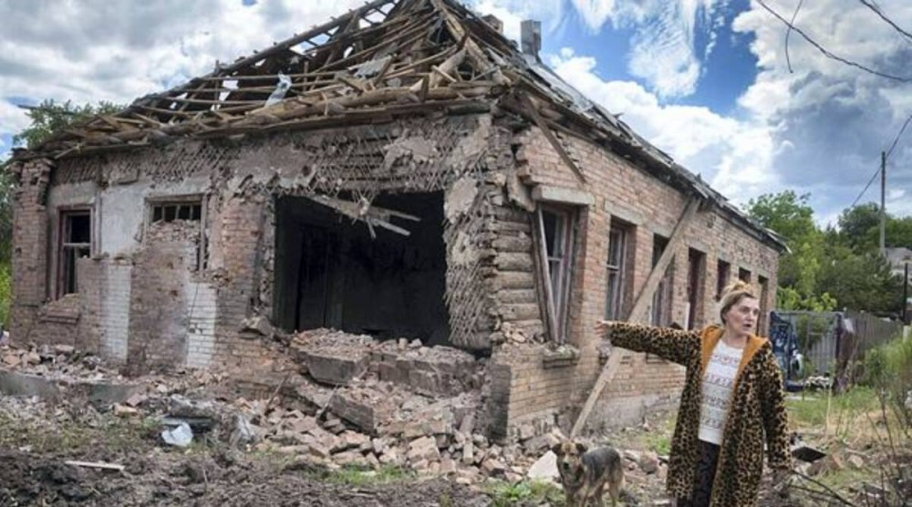 Local resident Tetyana points at her house heavily damaged by the Russian shelling in Bakhmut, Donetsk region, Ukraine, Friday, June 24, 2022. (AP/PTI)