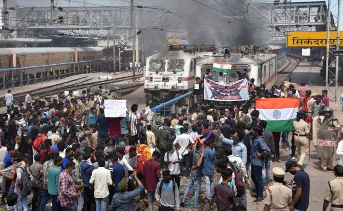 A mob vandalises trains and railway properties at the Secunderabad Railway Station in protest against the Central government’s ‘Agnipath’ scheme, near Hyderabad, Friday, June 17, 2022. Photograph: PTI Photo