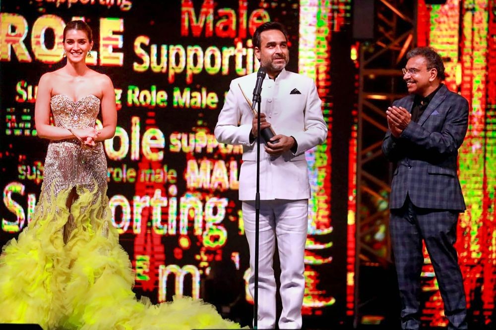 Abu Dhabi: Bollywood actor Pankaj Tripathi after receiving the International Indian Film Academy (IIFA) Award for his performance as a Supporting Role (Male) in 'Ludo', in Abu Dhabi, Saturday evening, June 4, 2022. (PTI Photo)