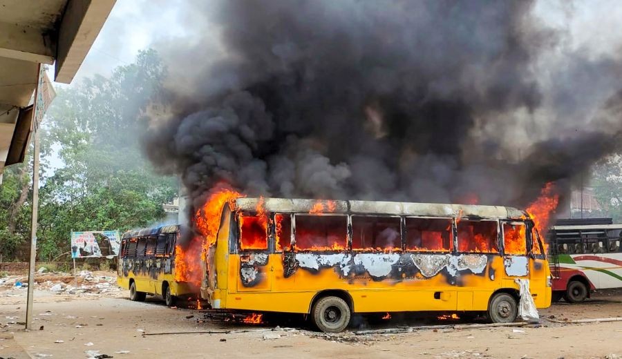 Aurangabad: Smoke billows from buses after they were set on fire by people protesting against Centre's 'Agnipath' scheme, in Aurangabad, Friday, June 17, 2022. (PTI Photo)