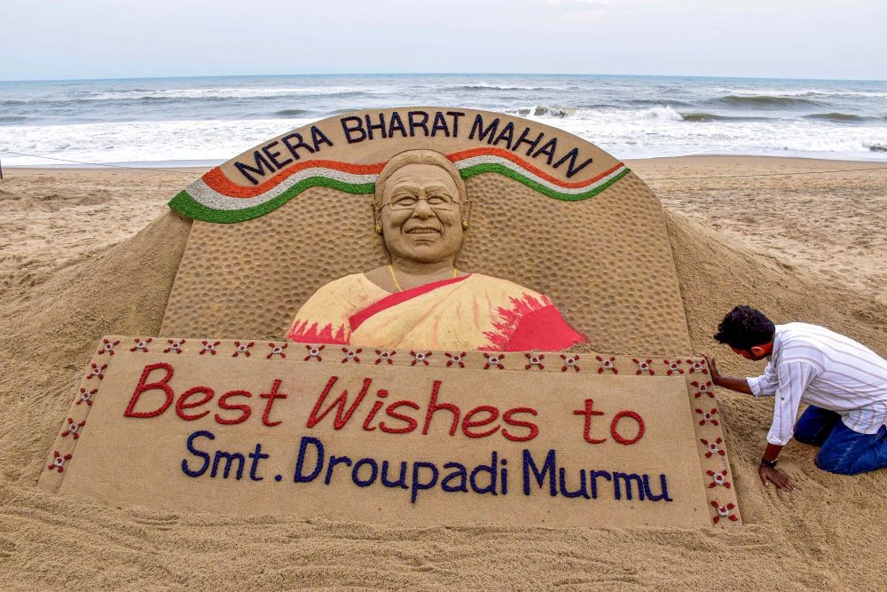 Puri: Sand artist Sudarshan Patnaik creates a sculpture in honour of NDA's Presidential candidate Droupadi Murmu, at a beach in Puri, Thursday, June 23, 2022. (PTI Photo)(