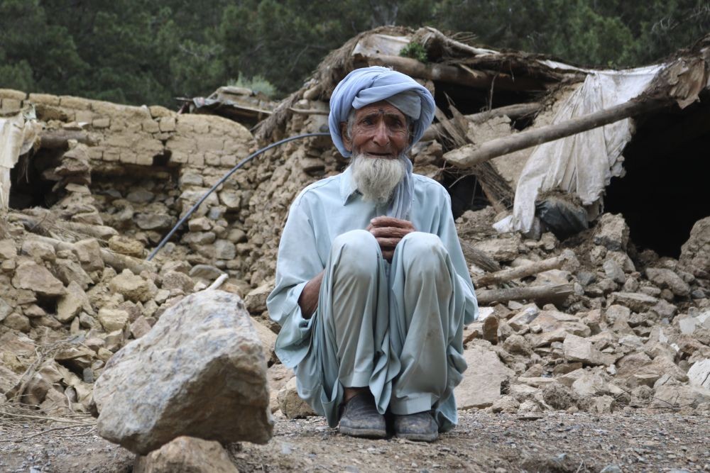 An Afghan man sits near his house that was destroyed in an earthquake in the Spera District of the southwestern part of Khost Province, Afghanistan, Wednesday, June 22, 2022. A powerful earthquake struck a rugged, mountainous region of eastern Afghanistan early Wednesday, killing at least 1,000 people and injuring 1,500 more in one of the country's deadliest quakes in decades, the state-run news agency reported. AP/PTI