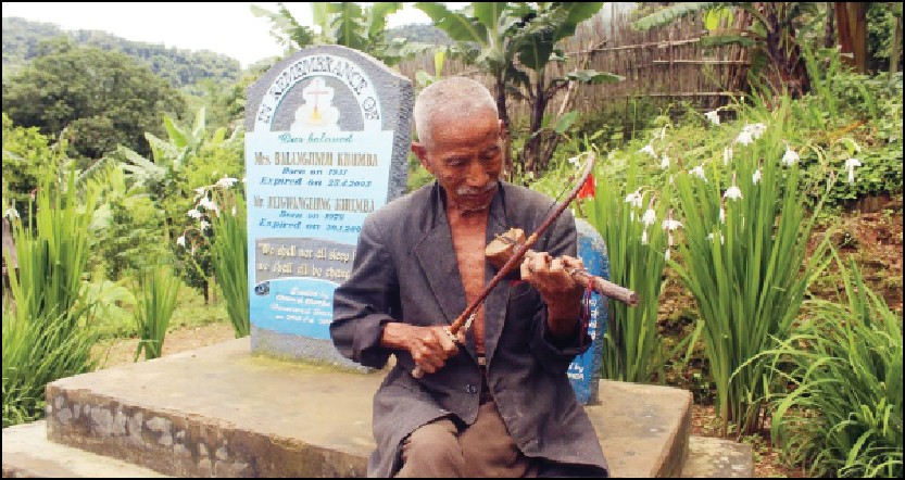 An old man playing a traditional musical instrument. (Photo Courtesy: Isaac Inkah)
