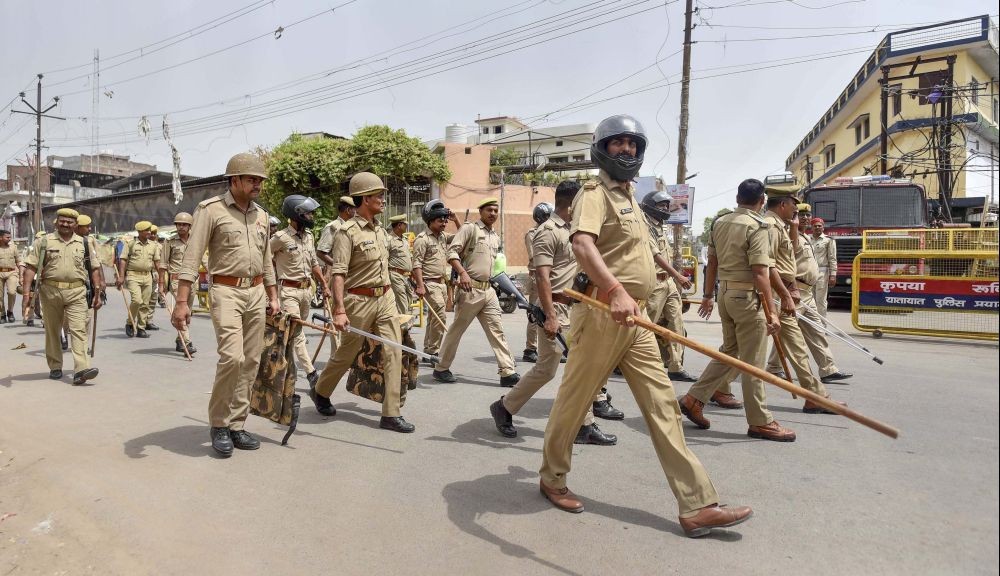 Prayagraj: Security personnel conduct a flag march, a day after clashes during protest against now-suspended BJP leaders remark on Prophet Muhammad, in Prayagraj, Saturday, June 11, 2022. (PTI Photo)