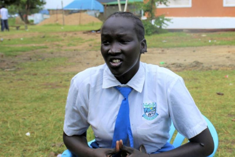 Nyanachiek Madit, 21, who successfully refused when her father told her at age 17 that she would be married off to a man about 50 years old because her family couldn't afford to send her to school, speaks to The Associated Press in Juba, South Sudan on June 8, 2022. (AP File Photo)