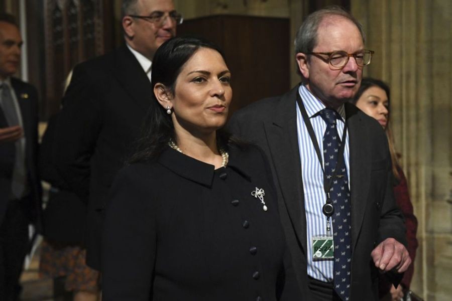 Britain's Home Secretary Priti Patel walks through the Central Lobby at the Palace of Westminster, during the State Opening of Parliament, in the Houses of Parliament, in London, Tuesday, May 10, 2022. [AP Photo/Justin Tallis/Pool Photo]