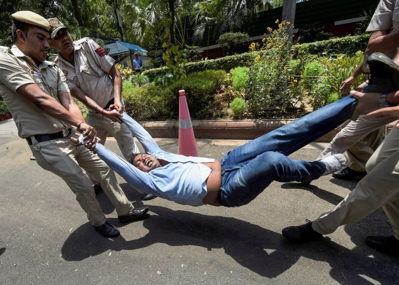 Youth Congress President Srinivas BV being detained during a protest outside the AICC office against summoning of party leader Rahul Gandhi by the Enforcement Directorate (ED) in connection with the National Herald case, in New Delhi on June 15, 2022. (PTI Photo)