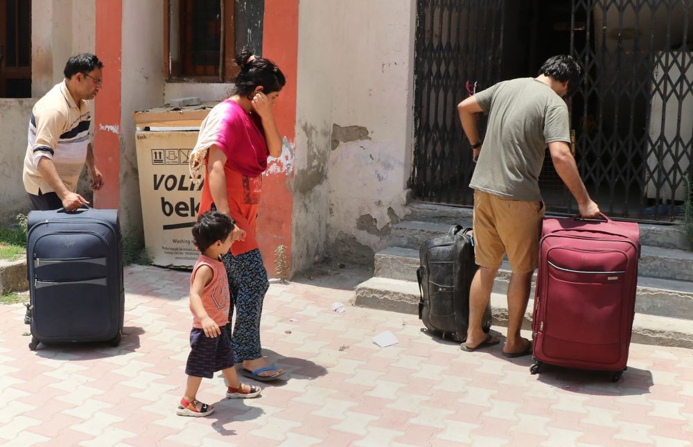 Jammu: A Kashmiri Pandit family returns to Jagti Migrants Camp in the wake of recent killings of employees in Kashmir by terrorists, in Jammu, Friday, June 3, 2022. (PTI Photo)