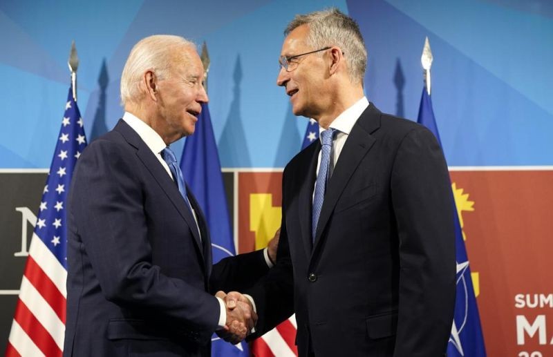 U.S. President Joe Biden, left, is greeted by NATO Secretary General Jens Stoltenberg during arrival for a NATO summit in Madrid, Spain on Wednesday, June 29, 2022. North Atlantic Treaty Organization heads of state and government will meet for a NATO summit in Madrid from Tuesday through Thursday. (AP Photo)