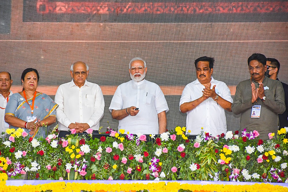 Prime Minister Narendra Modi during inauguration and foundation stone laying ceremony of multiple development projects, during the ‘Gujarat Gaurav Abhiyan’, in Navsari on June 10. Gujarat CM Bhupendra Patel is also seen. (PTI Photo)