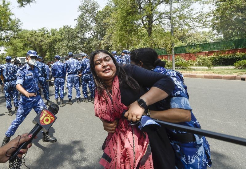 Police detain Congress leader Ragini Naik during a protest outside the AICC office against summoning of party leader Rahul Gandhi by the Enforcement Directorate (ED) in connection with the National Herald case, in New Delhi on June 15, 2022. (PTI Photo)