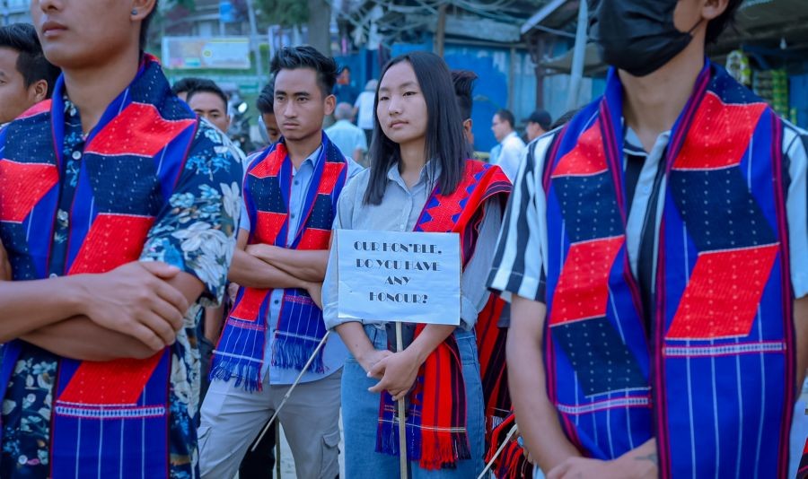 Participants displaying placards during the programme organised by the CWS at Clock Tower, Tuensang town on June 20. (Morung Photo)