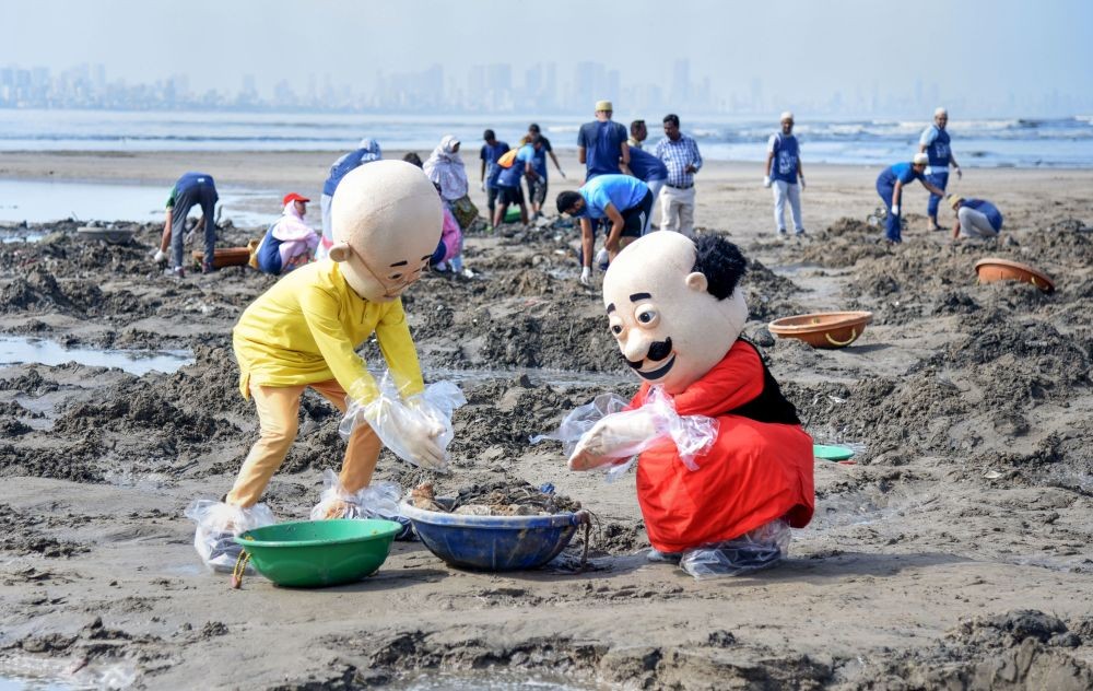 Mumbai: Activists dressed as cartoon characters clean the Versova beach, on the occasion of World Environment Day, in Mumbai, Sunday, June 5, 2022. (PTI Photo)