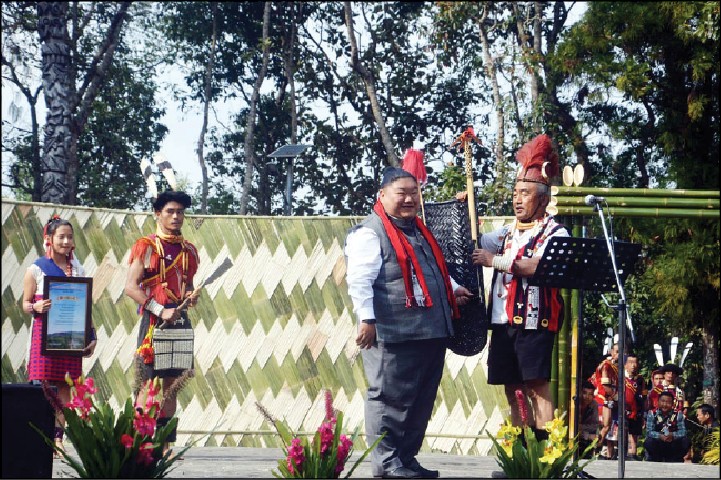 Nagaland Minister for Higher & Technical Education, Temjen Imna Along Longkumer being welcomed at the cultural extravaganza held at Süngkotenem Park, Mopungchuket village on January 29. (Morung Photo)