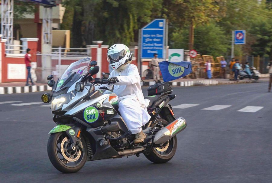 Bhopal: Isha Foundation founder Sadhguru Jaggi Vasudev rides a two-wheeler amid his 'Save Soil' public awareness programme, near Motilal Nehru Stadium in Bhopal, Thursday, June 9, 2022. (PTI Photo)