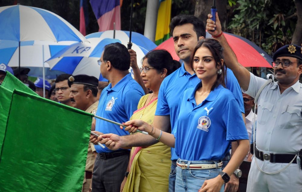Kolkata: Film actress and Trinamool Congress MP Nusrat Jahan, West Bengal Minister Shashi Panja and film actor Abir Chatterjee during the flagging off ceremony of a tableau on International Day Against Drug Abuse & Illicit Trafficking, in Kolkata, Sunday, June 26, 2022. (PTI Photo)(
