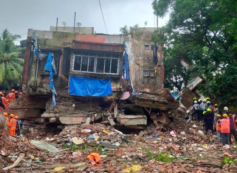 Rescue operation underway after a four-storey building collapsed  at Naik Nagar in Kurla East, Mumbai. Photograph: PTI Photo