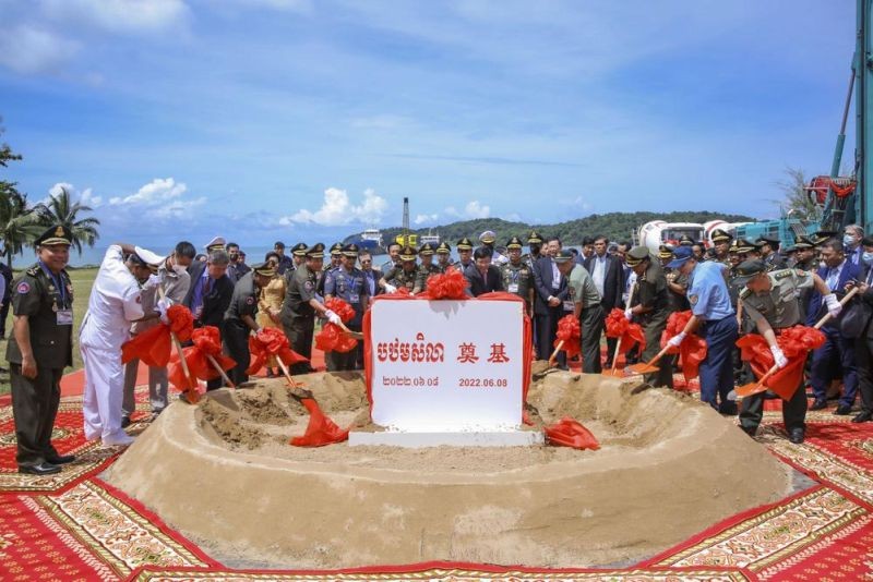 In this photo provided by Cambodia's Fresh News, Cambodian Defense Minister Tea Banh, rear center left, and Chinese Ambassador to Cambodia Wang Wentian, rear center right, preside over the groundbreaking ceremony for a shipyard repairing and restoration workshop in Ream Cambodian Naval Base of Sihanoukville, Wednesday, June 8, 2022. Chinese and Cambodian officials broke ground Wednesday on a naval port expansion project, dismissing American concerns it could provide Beijing with a strategically important outpost on the Gulf of Thailand. (AP Photo)