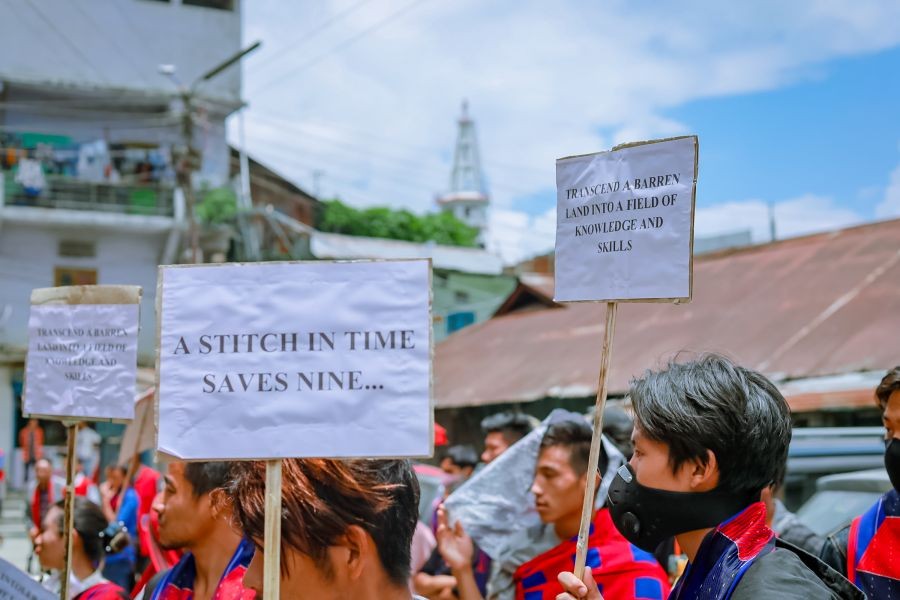 Participants displaying placards during the programme organised by the CWS at Clock Tower, Tuensang town on June 20. (Morung Photo)