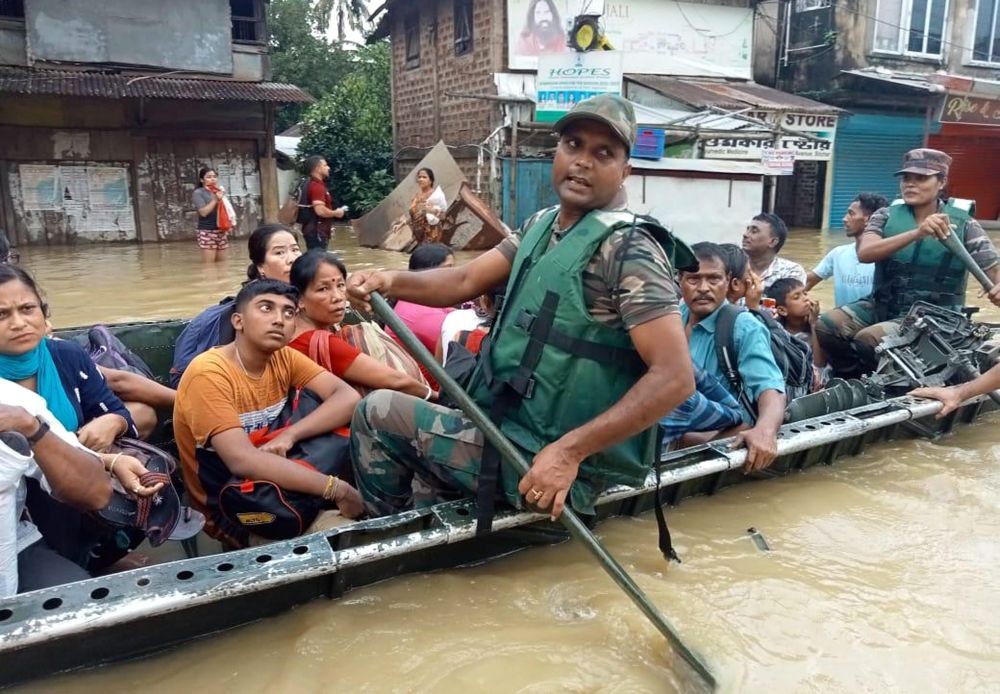 Silchar: Security personnel rescue people from a flood-affected area in Silchar, Monday, June 20, 2022. (PTI Photo)