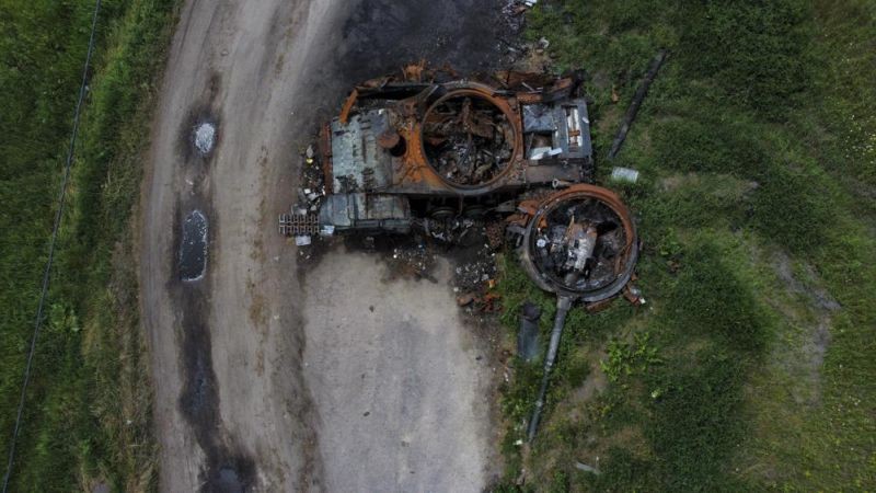 The gutted remains of a tank lie by a road in Lypivka, on the outskirts of Kyiv, Ukraine, Tuesday, June 14, 2022. (AP Photo)