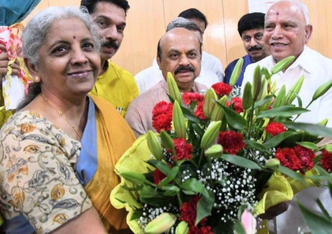 Karnataka Chief Minister Basavaraj Bommai with Union Finance Minister and BJP candidate Nirmala Sitharaman as she celebrates her victory in the Rajya Sabha elections 2022. Photograph: Courtesy @BJP4Karnataka/Twitter