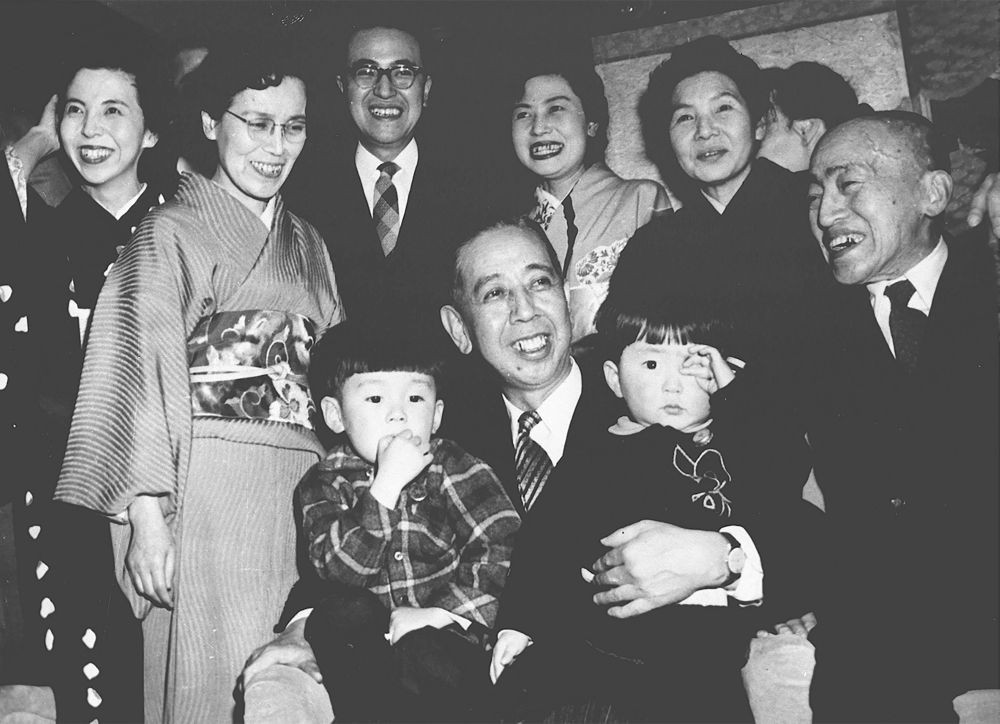 Shinzo Abe, front right, is held by his grandfather Nobusuke Kishi, front center, when Kishi was sworn in as new prime minister  at an unknown place in Japan in February 1957. Japan‚Äôs longest-serving prime minister, Shinzo Abe was credited with instilling political and economic stability. However, he angered Japan‚Äôs neighbors South Korea and China along with many Japanese with his nationalistic rhetoric and calls to revise the country‚Äôs pacifist constitution. AP/PTI
