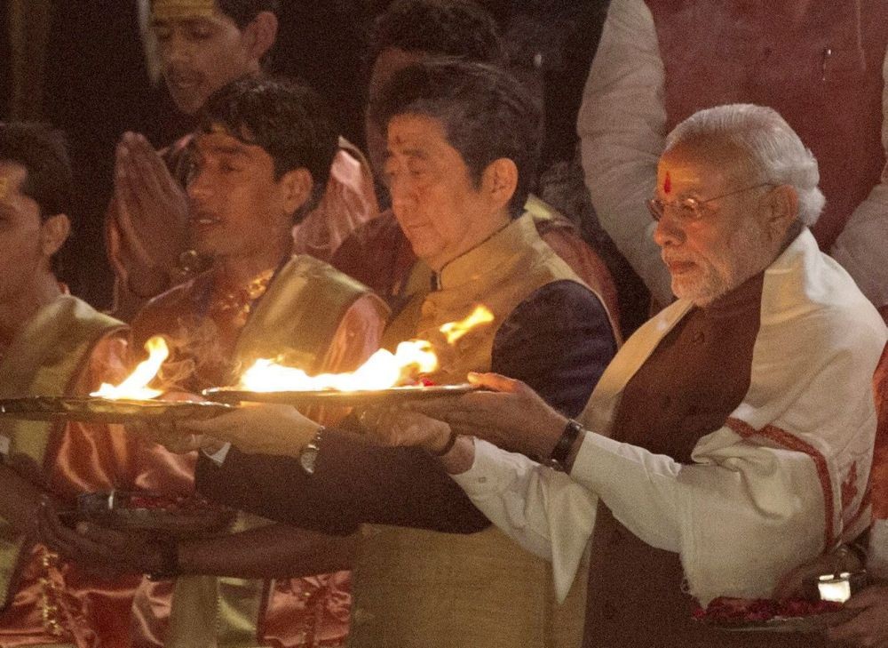 *EDS: FILE IMAGE** Varanasi: In this Saturday, Dec 12, 2015 file image former Japanese Prime Minister Shinzo Abe and PM Narendra Modi take part in the 'Ganga Arti' in Varanasi, Uttar Pradesh. Abe has died after being shot Friday, July 8, 2022 morning while campaigning for a parliamentary election in the Nara region. (PTI Photo)