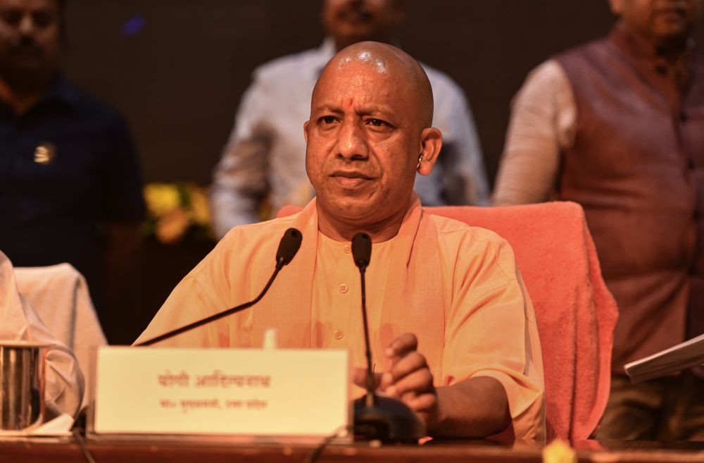 Lucknow: Uttar Pradesh Chief Minister Yogi Adityanath addresses a press conference on the completion of 100 days of his government in his second tenure, at Lok Bhawan in Lucknow, Monday, July 4, 2022. (PTI Photo/Nand Kumar)