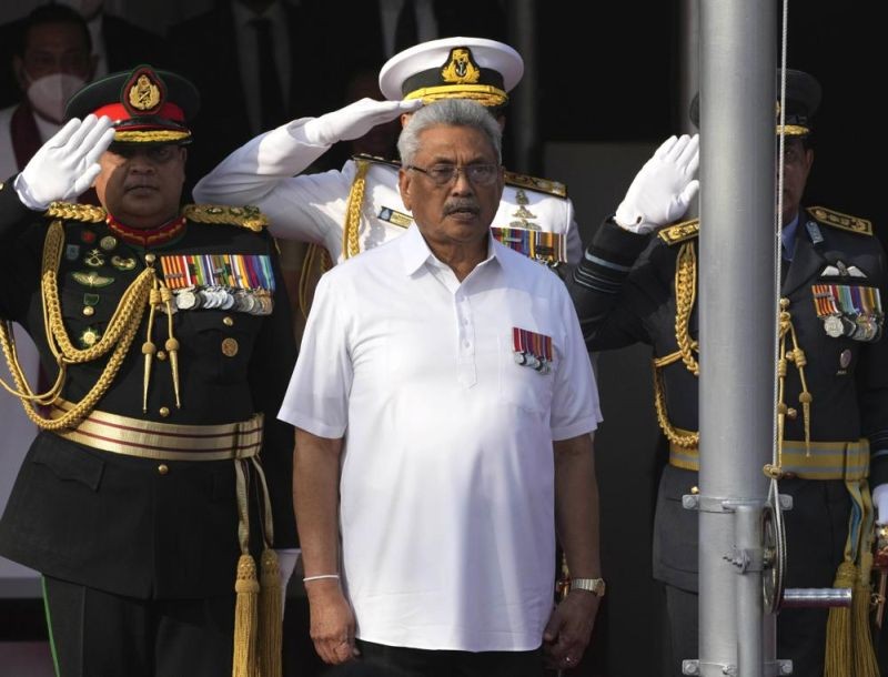 Sri Lankan President Gotabaya Rajapaksa sings the national anthem of Sri Lanka during the country's Independence Day celebration in Colombo, Sri Lanka, Feb. 4, 2022. The president of Sri Lanka fled the country early Wednesday, July 13, 2022, days after protesters stormed his home and office and the official residence of his prime minister amid a three-month economic crisis that triggered severe shortages of food and fuel.(AP File Photo)