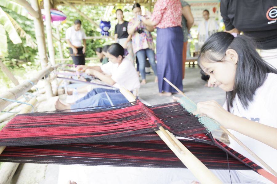 A participant tries her hand at weaving during the workshop at Weavers Place, Diezephe Village on July 21. (Morung Photo)