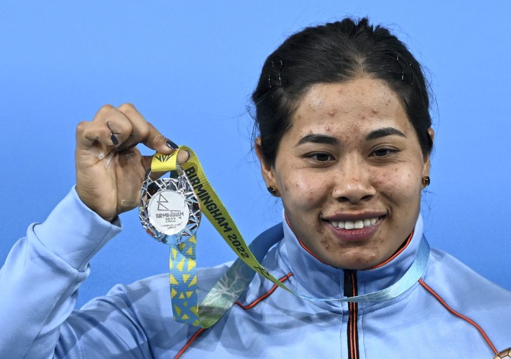 Birmingham: India's Bindyarani Devi Sorokhaibam with the silver medal after competing in the women's 55kg weightlifting category match of the Commonwealth Games 2022 (CWG), in Birmingham, UK, Saturday, July 30, 2022. Devi won the silver medal. (PTI Photo/Swapan Mahapatra)(