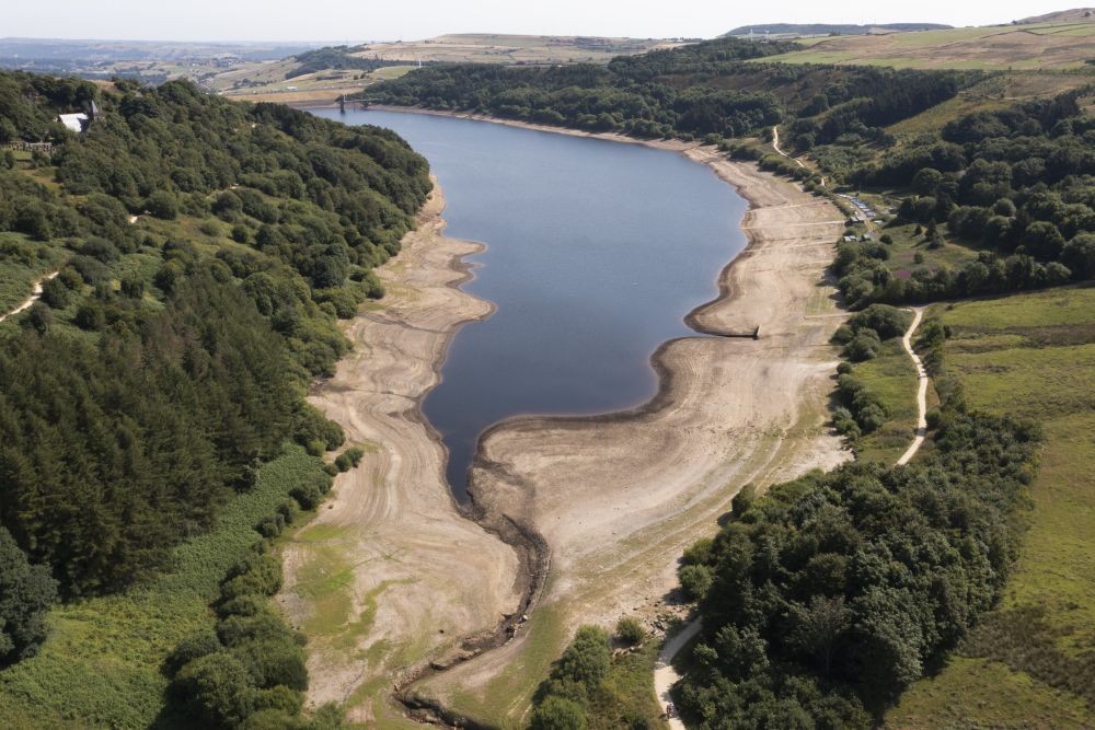 Low water levels are seen at Scammonden Reservoir in West Yorkshire as reservoir levels dip dangerously low amid record high temperatures in the UK. The UK's first ever red warning for exceptional heat came into force at midnight on Sunday, with temperatures expected to climb up to 41C (105.8F) over the next two days, breaking the country's heat records, Oldham, England, Monday, July 18, 2022. AP/PTI