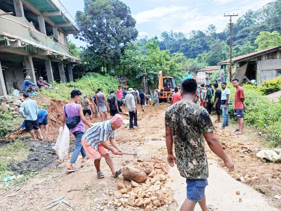 Public repairing the road at Medziphema town on July 16.