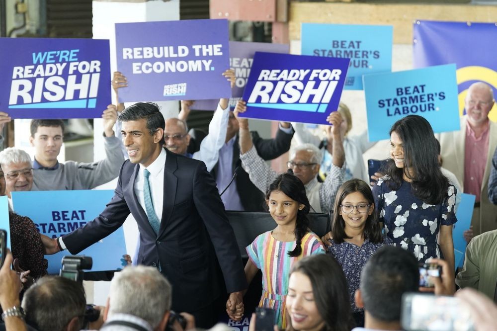 Former Treasury chief Rishi Sunak, left, arrives with with daughters Krishna, Anushka and wife Akshata Murthy at Vaculug tyre specialists as part of his campaign to be leader of the Conservative and Unionist Party and the next prime minister, at Gonerby Hill Foot, in Grantham, England, Saturday, July 23, 2022. Sunak and Foreign Secretary Liz Truss  were chosen Wednesday by Conservative lawmakers ‚Äî whittled down from an initial field of 11 candidates ‚Äî- as finalists to replace outgoing British Prime Minister Boris Johnson, who quit as party leader on July 7 after months of ethics scandals. AP/PTI(