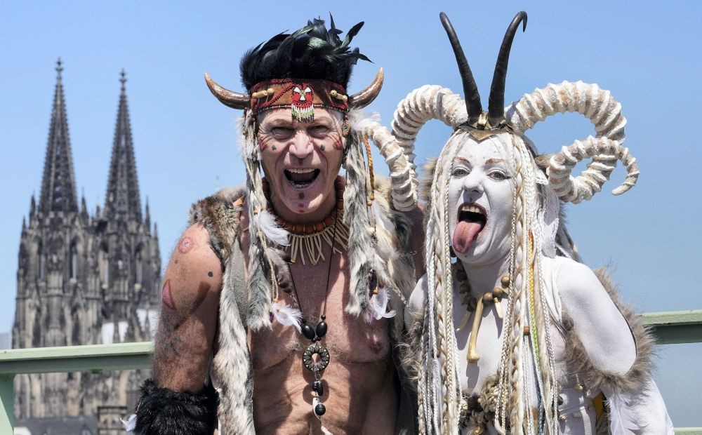 Colognel: Participants of the Cologne Pride rally pose in front of the Cathedral in Cologne, Germany, Sunday, July 3, 2022. This year's Christopher Street Day (CSD) Gay Parade with thousands of demonstrators for LGBTQ rights is the first after the coronavirus pandemic to be followed by hundreds of thousands of spectators in the streets of Cologne.AP/PTI Photo