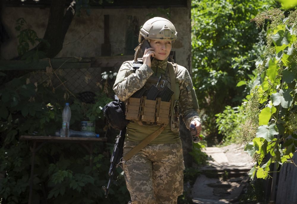 Ukrainian platoon commander Mariia talks on the phone in a position in the Donetsk region, Ukraine, Saturday, July 2, 2022. Ukrainian soldiers returning from the frontlines in eastern Ukraine’s Donbas region describe life during what has turned into a grueling war of attrition as apocalyptic. Mariia, 41, said that front-line conditions may vary depending on where a unit is positioned and how well supplied they are. AP/PTI